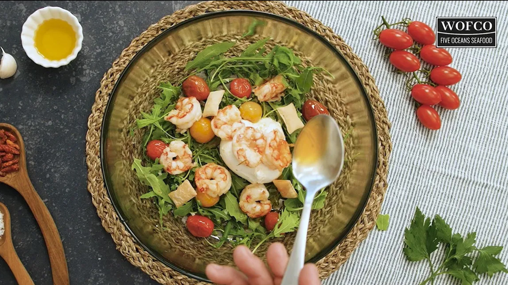 Warm salad with garlic argentine red shrimps, burrata and cherry tomatoes